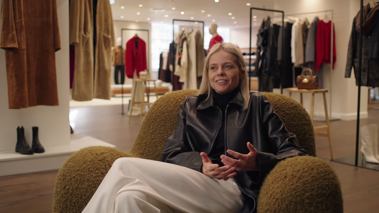 Julia from Harvey Nichols being interviewed on the shop floor